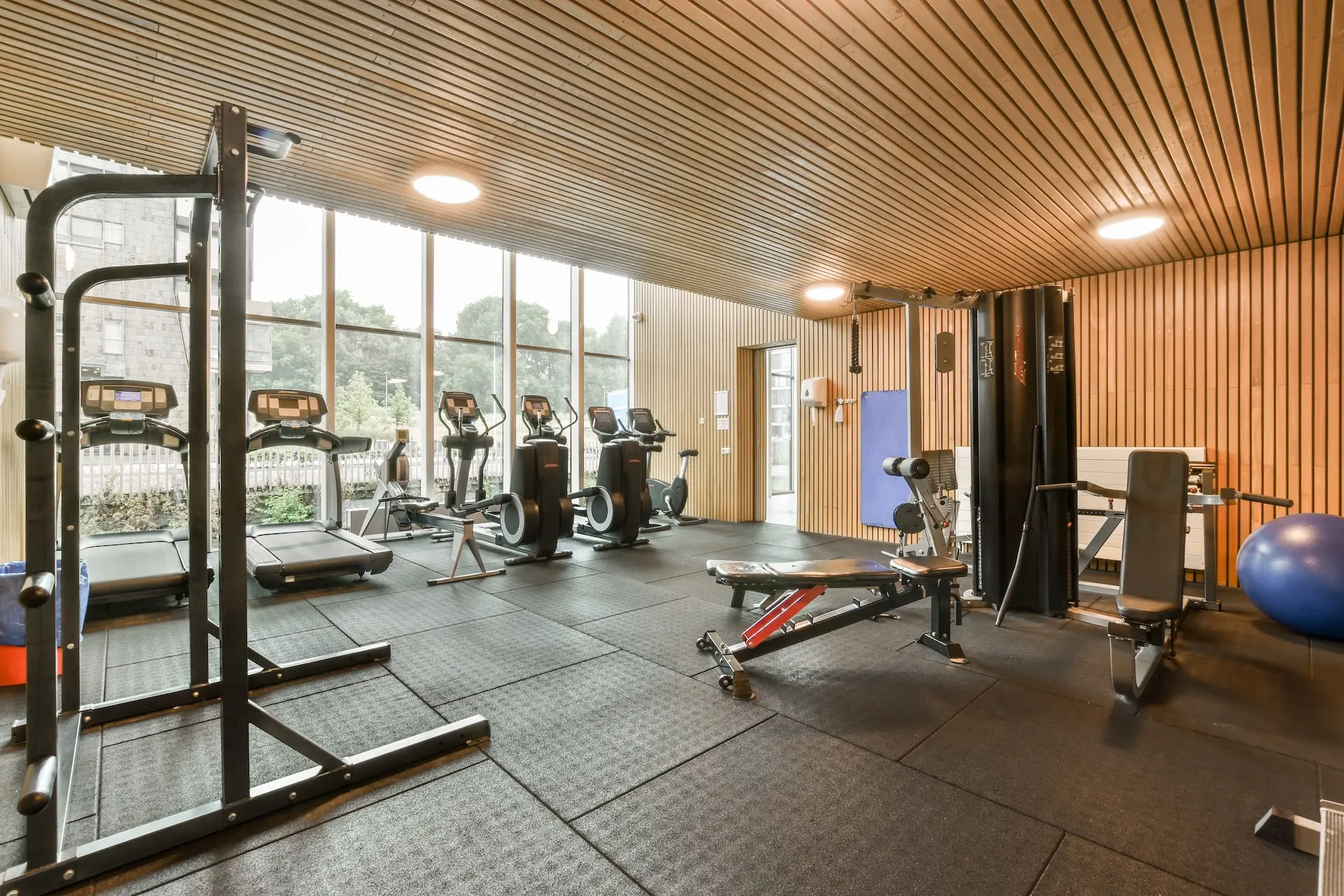 a gym with a lot of exercise equipment and windows 2025 02 10 05 36 09 utc