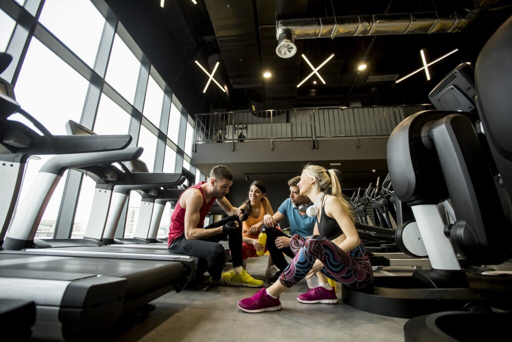 friends in sportswear talking and laughing togethe 2025 02 21 11 37 19 utc